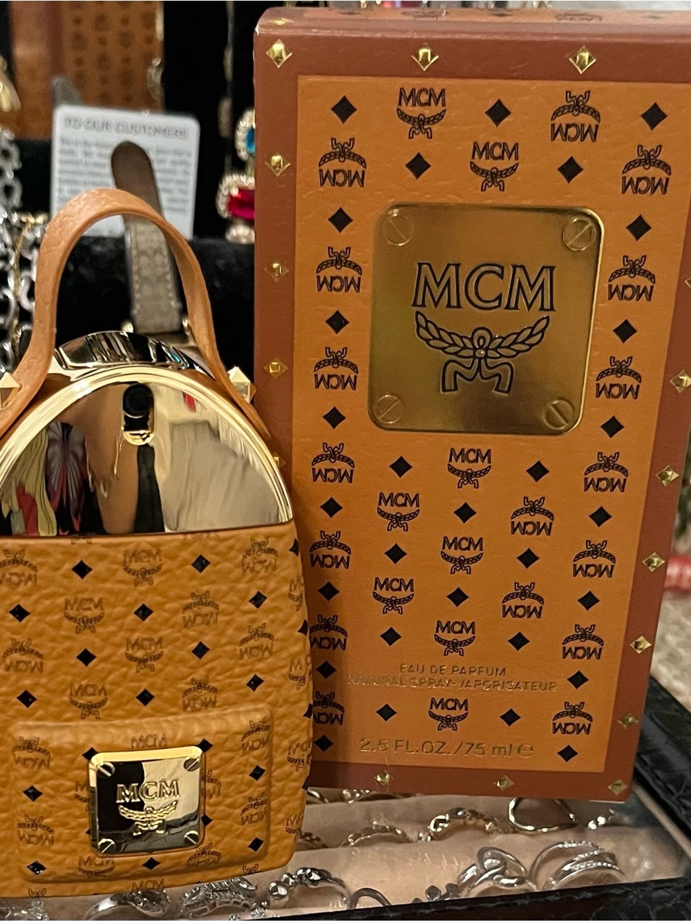 MCM Cognac Logo Mini Backpack with Gold Plate perfume